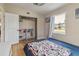 Bedroom featuring closet, hardwood floors, and window with view to outside at 21070 Gertrude Ave, Port Charlotte, FL 33952