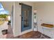 Welcoming front entrance with a decorative glass door and a charming 'Home' sign at 21070 Gertrude Ave, Port Charlotte, FL 33952