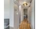 Hallway with wood floors leading to various rooms in the home at 21070 Gertrude Ave, Port Charlotte, FL 33952