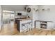 Stylish eat-in kitchen featuring modern appliances, pendant lighting, and ample countertop space at 21070 Gertrude Ave, Port Charlotte, FL 33952