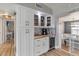 A kitchen featuring white cabinets, a wine fridge, and wood countertops at 21070 Gertrude Ave, Port Charlotte, FL 33952