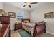 Cozy bedroom with a wood-framed bed, dresser, neutral walls, and a ceiling fan for added comfort at 27 Tee View Rd, Rotonda West, FL 33947