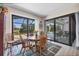 This dining area is bright and has great views of the pool from the adjacent sliding glass doors at 27 Tee View Rd, Rotonda West, FL 33947