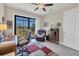 Bright home office with a screen patio view, complete with a desk, chair, and ample natural light at 27 Tee View Rd, Rotonda West, FL 33947