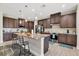 This gorgeous kitchen features stainless appliances, a large island and lots of cabinet space at 27 Tee View Rd, Rotonda West, FL 33947
