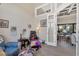 Spacious living room featuring comfortable armchairs and bright natural light, perfect for relaxation and entertaining at 27 Tee View Rd, Rotonda West, FL 33947