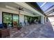 Expansive covered patio with ceiling fans and comfortable seating, ideal for outdoor living and entertaining at 27 Tee View Rd, Rotonda West, FL 33947