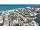 Coastal community featuring a pool, boat dock, and condos near a sandy beach and ocean at 2769 N Beach Rd # 205, Englewood, FL 34223