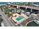 Serene aerial of the community pool, boat docks, and nearby beach access at 2769 N Beach Rd # 205, Englewood, FL 34223