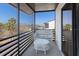 Screened balcony provides a relaxing outdoor space with seating and views of the surrounding neighborhood at 2769 N Beach Rd # 205, Englewood, FL 34223