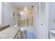 Well-lit bathroom with granite countertop, shower-tub combination, toilet, and storage closet at 2769 N Beach Rd # 205, Englewood, FL 34223