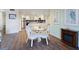 Cozy dining area with a glass table and wicker chairs, adjacent to the bright kitchen with white cabinets at 2769 N Beach Rd # 205, Englewood, FL 34223