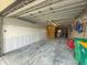 Attached garage with space for storage and activities, plus utility closet at 2769 N Beach Rd # 205, Englewood, FL 34223