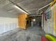Attached garage with lots of storage capacity including a separate storage area and shelving at 2769 N Beach Rd # 205, Englewood, FL 34223