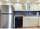 Updated kitchen featuring stainless steel appliances, modern cabinetry, and granite countertops at 2769 N Beach Rd # 205, Englewood, FL 34223