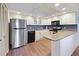 Well-equipped kitchen featuring stainless steel appliances, granite countertops, and ample cabinet space at 2769 N Beach Rd # 205, Englewood, FL 34223