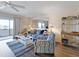 Comfortable condo living room featuring modern furniture, rug, and sliders to the balcony at 2769 N Beach Rd # 205, Englewood, FL 34223