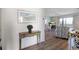 Condo featuring wood floors, dining area, and a comfortable living space at 2769 N Beach Rd # 205, Englewood, FL 34223