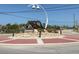 A decorative roundabout with a large sculpture of a shell and a street lamp at 2769 N Beach Rd # 205, Englewood, FL 34223