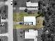 Aerial view of a single-story home with a large yard and driveway at 2906 Waterside Dr, Englewood, FL 34224
