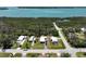 Aerial view of waterfront home featuring a truck and boat trailer in the driveway at 2906 Waterside Dr, Englewood, FL 34224