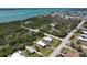 Overhead view of home with a waterfront view amidst lush greenery at 2906 Waterside Dr, Englewood, FL 34224
