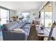 Open living room area with a comfortable couch and lots of sunlight at 2906 Waterside Dr, Englewood, FL 34224