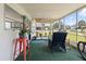 Inviting enclosed porch featuring comfortable seating and lots of sunlight at 2906 Waterside Dr, Englewood, FL 34224