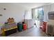 This storage room has lots of storage space and a sliding glass door to the outside at 2906 Waterside Dr, Englewood, FL 34224