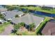 An aerial view of a home with a screened in lanai, and waterfront views at 35 Medalist Rd, Rotonda West, FL 33947