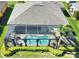 Aerial view of a home with a screened-in pool and landscaped backyard at 35 Medalist Rd, Rotonda West, FL 33947