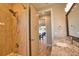 Bathroom featuring granite countertops, a bathtub, and a walk-in shower at 35 Medalist Rd, Rotonda West, FL 33947