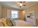 Inviting bedroom with ceiling fan, plantation shutters, and ample natural light at 35 Medalist Rd, Rotonda West, FL 33947