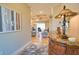Inviting foyer showcasing a view into the living area with hardwood floors and elegant decor at 35 Medalist Rd, Rotonda West, FL 33947