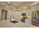 Bright kitchen featuring white cabinetry, stainless steel appliances, and quartz countertops at 35 Medalist Rd, Rotonda West, FL 33947