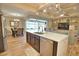 Gourmet kitchen boasts a large island, stainless appliances, and open concept to the living room and dining area at 35 Medalist Rd, Rotonda West, FL 33947