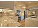 Well-equipped kitchen with granite counters, stainless appliances, and an island at 35 Medalist Rd, Rotonda West, FL 33947
