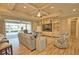 Open living area with built-in shelving, tile flooring, and access to an outdoor patio and pool at 35 Medalist Rd, Rotonda West, FL 33947