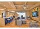 Open-concept living space with a modern kitchen, hardwood floors, and direct access to the outdoor patio at 35 Medalist Rd, Rotonda West, FL 33947