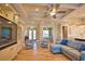 Bright living area featuring a built-in entertainment center, coffered ceiling, and views into multiple rooms at 35 Medalist Rd, Rotonda West, FL 33947