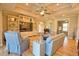 Spacious living room with built-in shelving, comfortable seating, and a bright, inviting atmosphere at 35 Medalist Rd, Rotonda West, FL 33947
