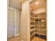 A walk-in pantry with wood-look flooring and wire shelving to keep your kitchen organized at 35 Medalist Rd, Rotonda West, FL 33947