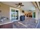 Outdoor patio with sink, grill, and access to screened-in pool at 35 Medalist Rd, Rotonda West, FL 33947