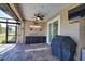 Screened-in patio with a built in outdoor kitchen at 35 Medalist Rd, Rotonda West, FL 33947
