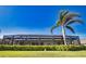 The home's screened in pool area and lush landscaping at 35 Medalist Rd, Rotonda West, FL 33947