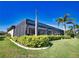 A beautiful, screened-in pool area with manicured landscaping surrounding the perimeter at 35 Medalist Rd, Rotonda West, FL 33947