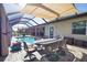 The backyard boasts a sparkling pool and a dining area for entertaining at 35 Medalist Rd, Rotonda West, FL 33947
