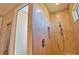 Walk-in shower featuring neutral tile, a built-in niche, and a modern shower head at 35 Medalist Rd, Rotonda West, FL 33947