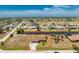 Waterfront home with mature landscaping, circular drive, and proximity to a golf course at 39 Bunker Pl, Rotonda West, FL 33947