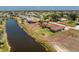 Panoramic aerial view of a beautiful home, near a canal, and in a serene neighborhood at 39 Bunker Pl, Rotonda West, FL 33947